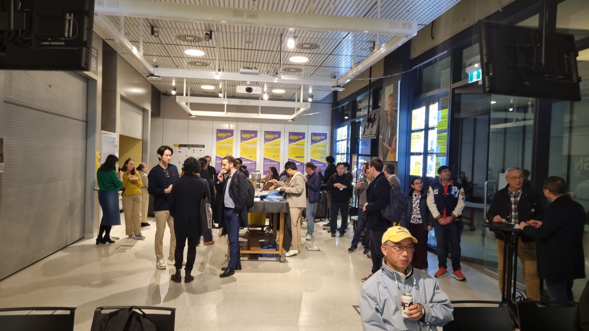 Melbourne Legal Quants members meeting and talking at an event