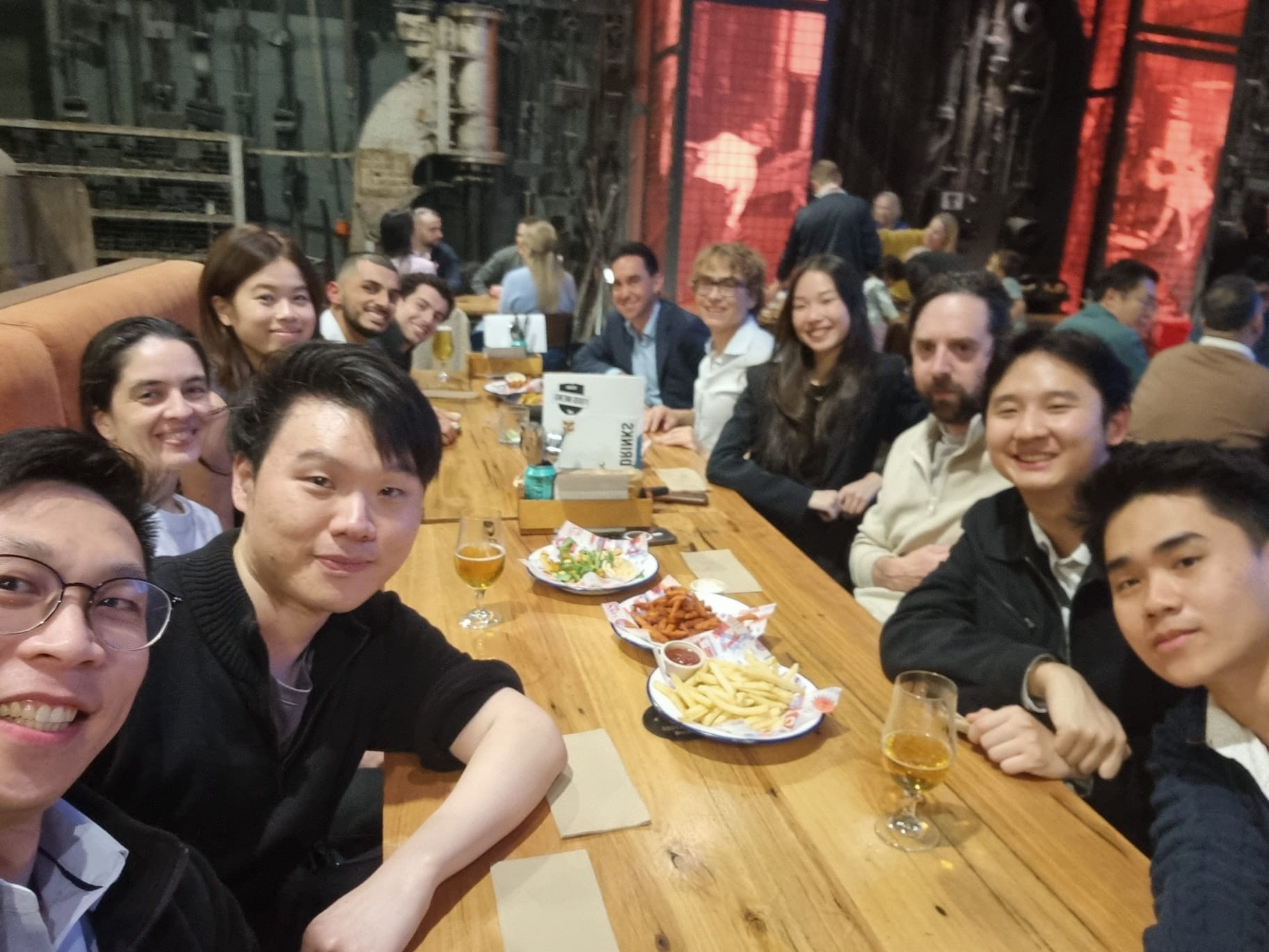Melbourne Legal Quants members smiling together around a dinner table