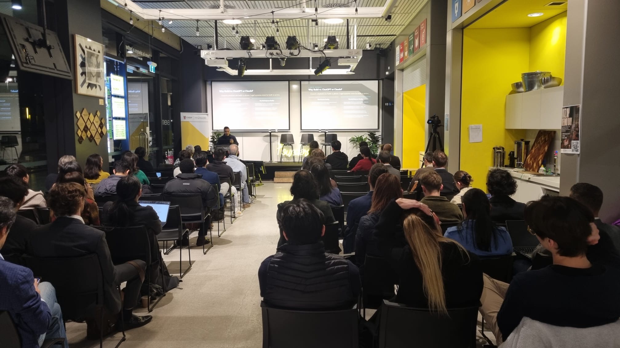 A speaker presenting to the Melbourne Legal Quants audience